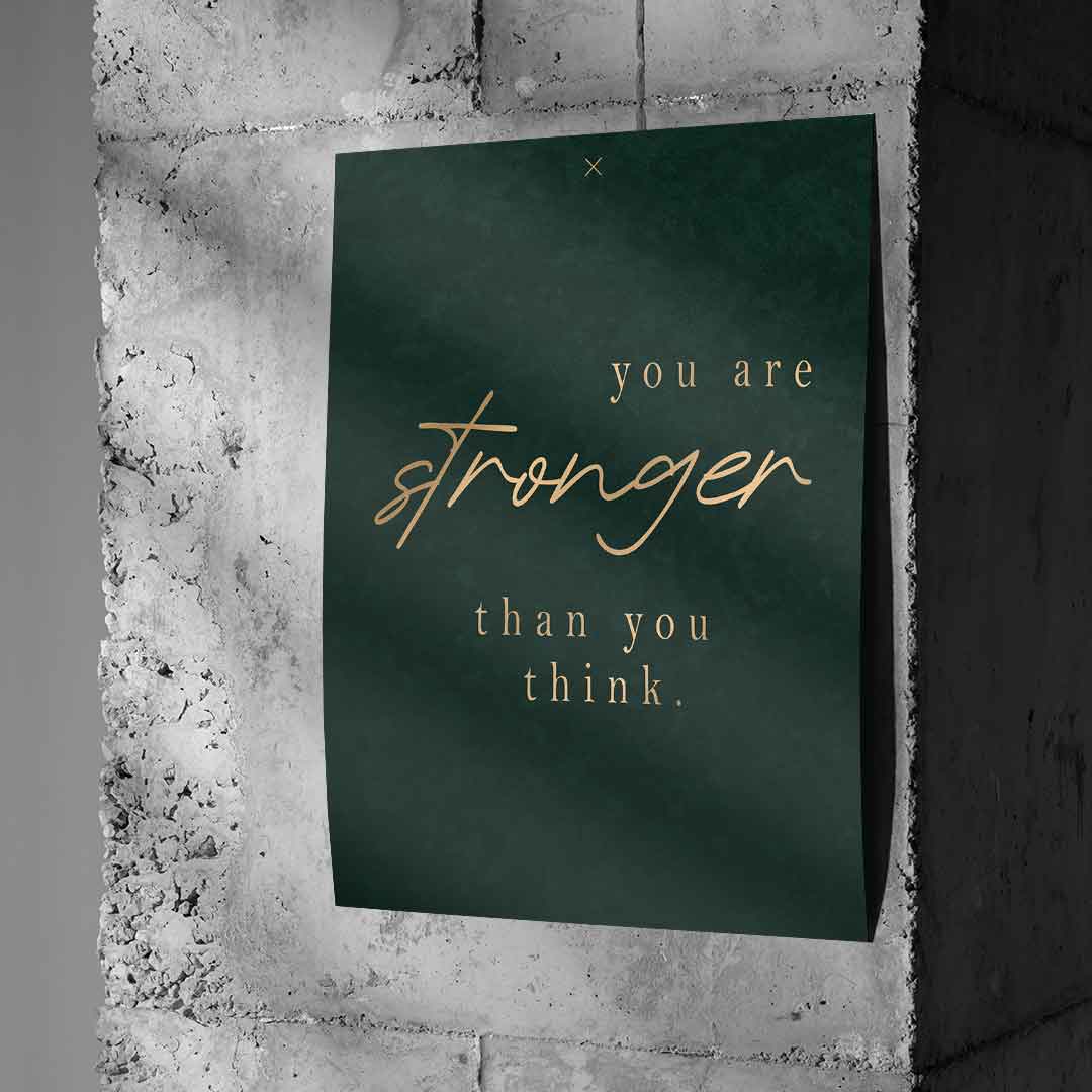 You are STRONGER Poster an Betonwand